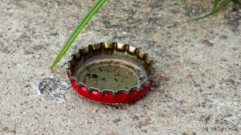 A bottle cap in Ecuador collects rainwater, providing a breeding site for dengue-carrying mosquitos.